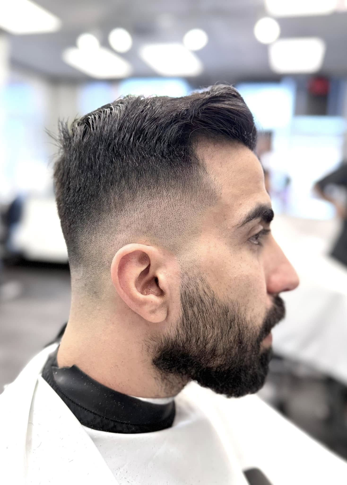Fresh fade with a clean beard detail.