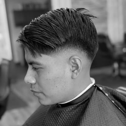 Sharp mid-fade and styled top.